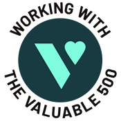 A dark teal circle, with a bright teal logo of the Valuable 500 inside it is shown. Around the circle black text reads ‘Working with the Valuable 500’.